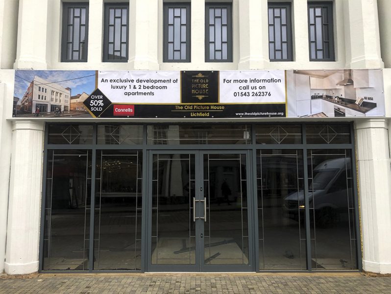 The front of an office building showcasing branding signage.